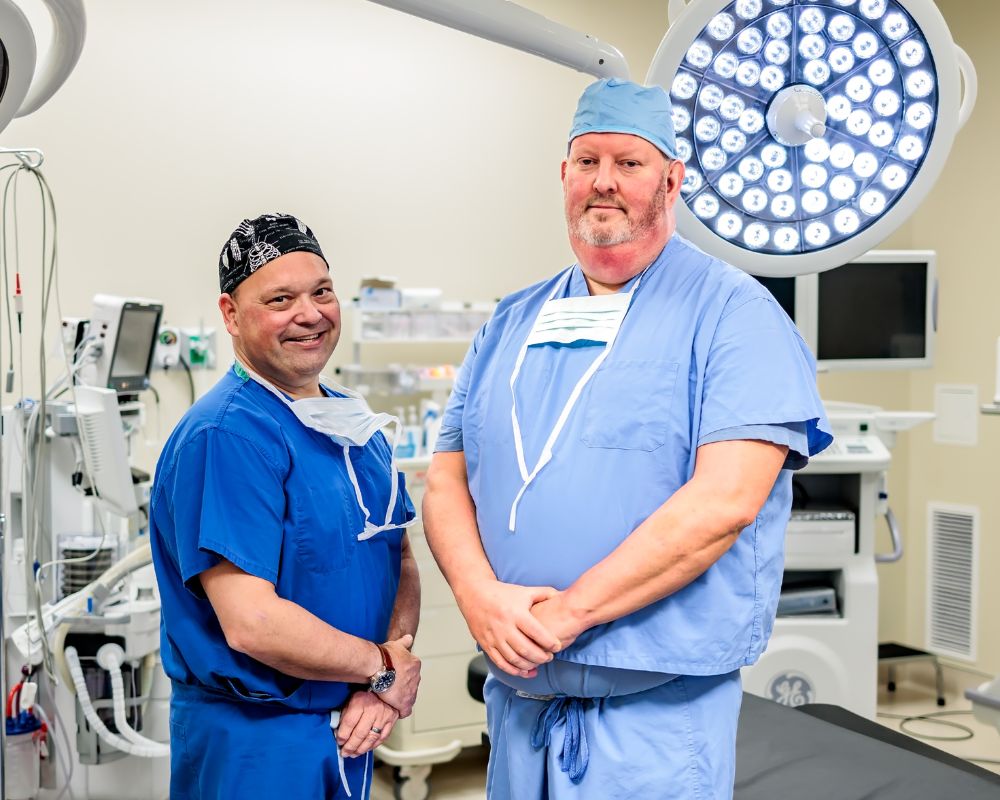 Chris Hemmer & Dr. Todd Stewart in surgery room